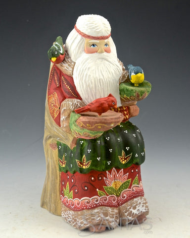 Peaceful Russian Santa Carving Feeding Several Birds