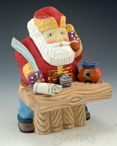 North Pole Logistics - Wooden Russian Santa at Desk