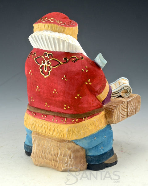 North Pole Logistics - Wooden Russian Santa at Desk