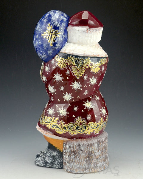 Shiny Red Russian Santa with Toy Bag and Tree sitting on Stump 10 inch