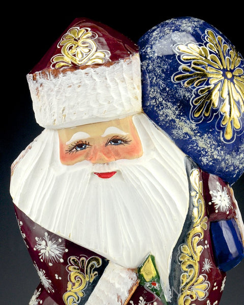 Shiny Red Russian Santa with Toy Bag and Tree sitting on Stump 10 inch