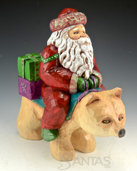 Santa Delivery on a Bear Wood Carving by Barbara Scoles