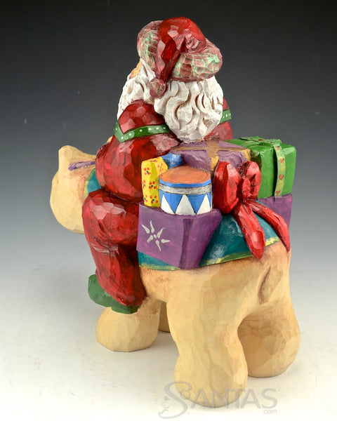 Santa Delivery on a Bear Wood Carving by Barbara Scoles