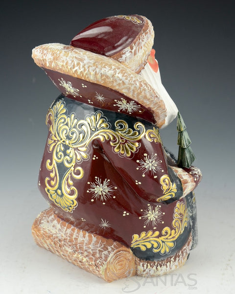 Burgundy and Gold Carved Russian Santa Sitting on a Log