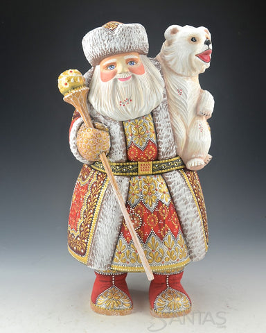 Red Russian Santa Carving holding a Polar Bear