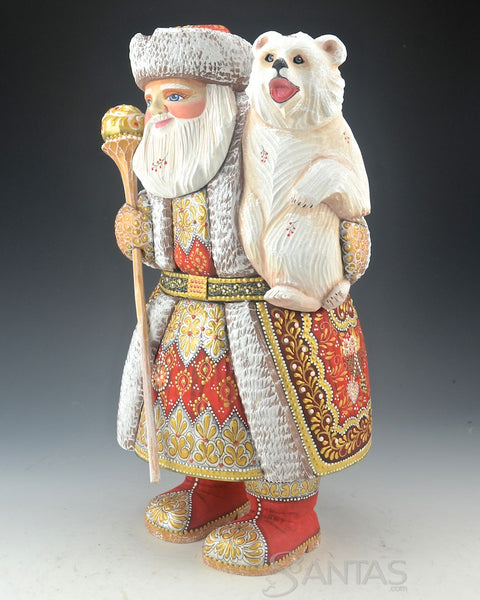 Red Russian Santa Carving holding a Polar Bear