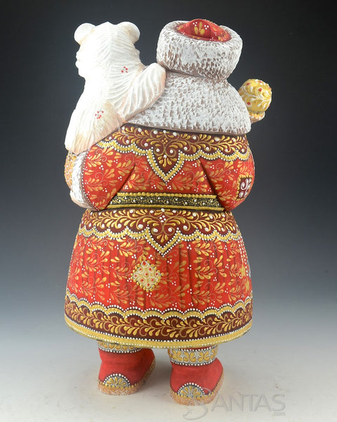 Red Russian Santa Carving holding a Polar Bear