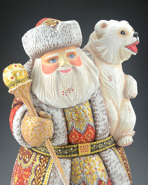 Red Russian Santa Carving holding a Polar Bear