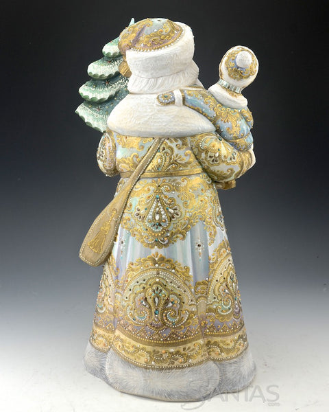 Elegant Russian Santa Carving Holding a Child and Christmas Tree