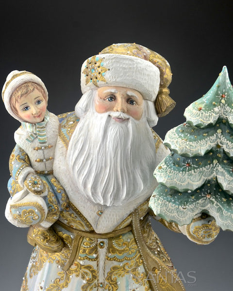 Elegant Russian Santa Carving Holding a Child and Christmas Tree