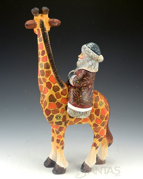 Russian Carved Santa Claus Riding on a Giraffe 13 inch