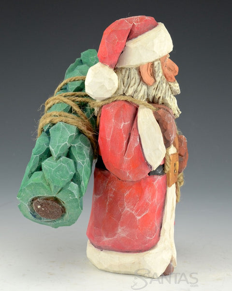 Santa Carrying Tree on His Back by Russell Scott