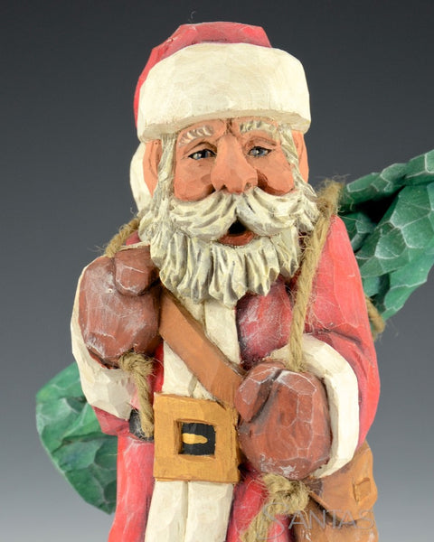 Santa Carrying Tree on His Back by Russell Scott