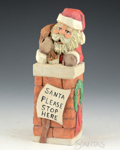 Carved Santa in the Chimney by Russell Scott