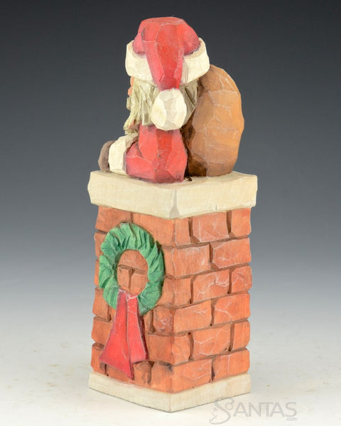 Carved Santa in the Chimney by Russell Scott