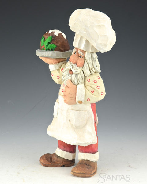 Russell Scott Chef Santa carving with Plum Pudding