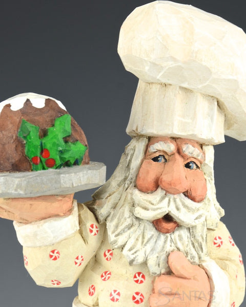 Russell Scott Chef Santa carving with Plum Pudding