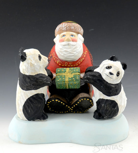 Santa Claus with Two Panda Bears