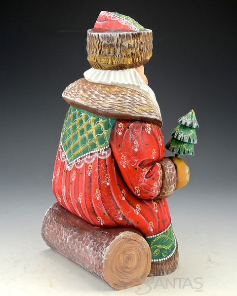 Red and Green Russian Santa With Little Tree Sitting on a Log 10 inch